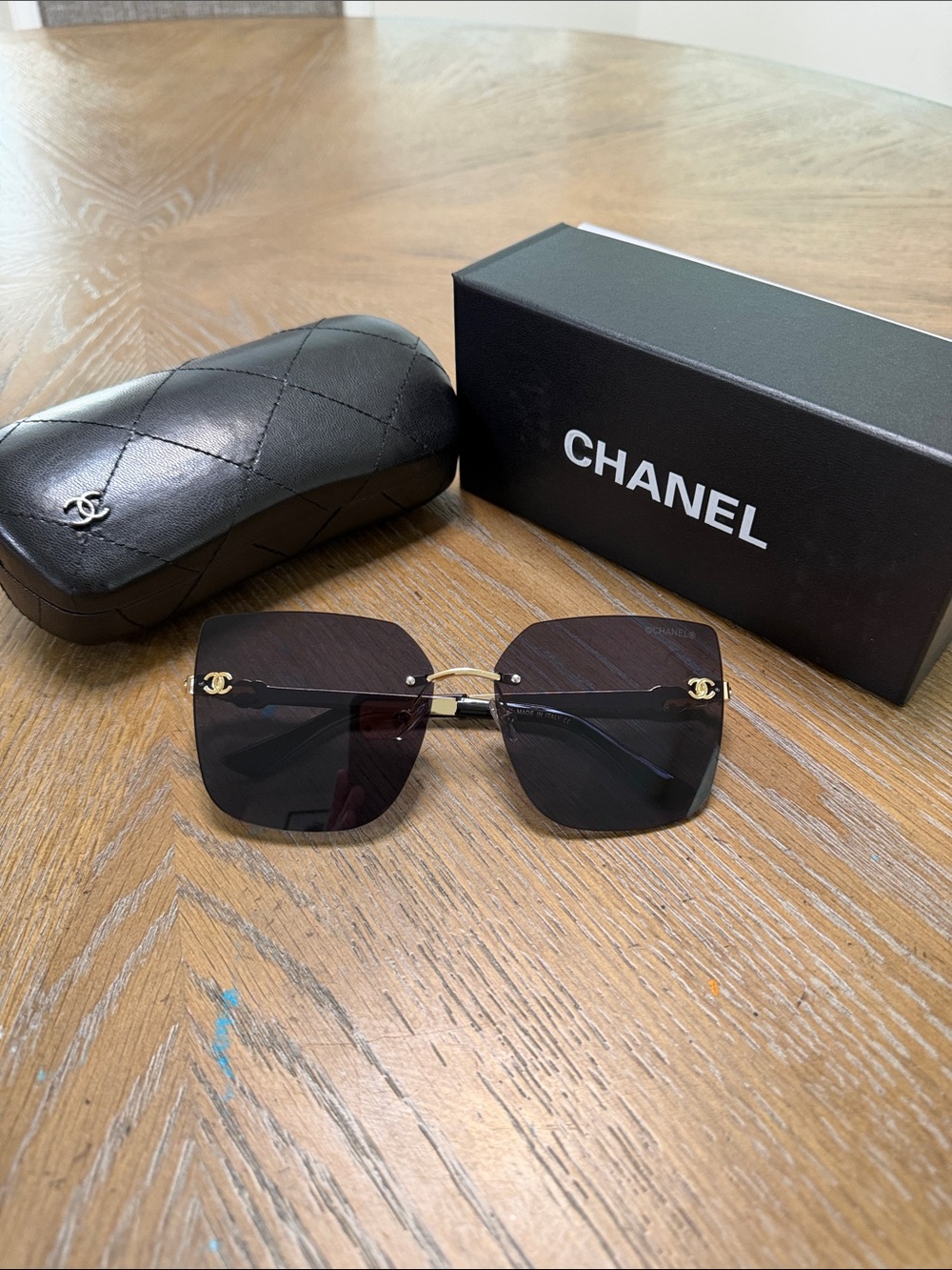 CHANEL Black Rimless Square Sunglasses with Gold Accents